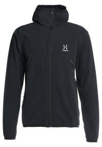 Veste noire zippée en matériau soft-shell, dotée d'une capuche, de manches longues, de poches latérales, et d'un logo blanc sur la poitrine.