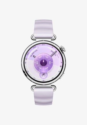 Runder silberner Uhr mit lilafarbenem Silikonarmband. Das Ziffernblatt zeigt konzentrische Kreise in schattierten lila Tönen mit verschiedenen Messmarkierungen.