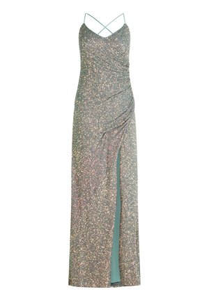 Robe verte étincelante avec un décolleté en V profond, des bretelles fines ajustables, des détails froncés sur les côtés et une fente jusqu'à la cuisse. Tissu doux et texturé.