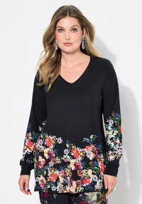 Schwarzes Langarm-V-Ausschnitt-Oberteil mit einem bunten Blumendesign am Saum und an den Ärmeln, aus weichem, dehnbarem Stoff.