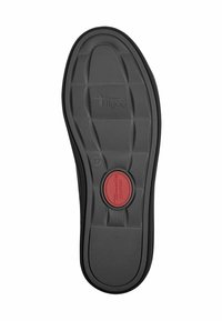 Semelle de chaussure noire en caoutchouc avec une surface texturée, dotée d'un insert de confort circulaire rouge central et de motifs rectangulaires sur toute la surface.