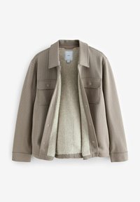 Veste beige texturée avec col et fermeture avant à boutons-pression, doublée en molleton doux de couleur crème, dotée de deux poches à rabat à l'avant.