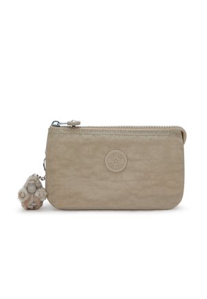 Beige rectangular zippered pouch with round logo patch on front and small plush monkey keychain attached to zipper pull.