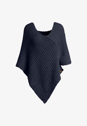 Poncho de punto texturizado en azul marino oscuro con mangas cortas y un amplio escote redondeado, exhibido sobre un fondo blanco.
