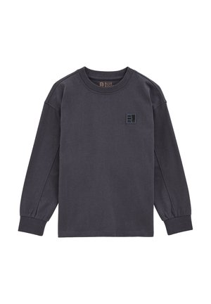 Langärmliges, dunkelgraues Shirt aus weichem Material. Hat einen Rundhalsausschnitt und ein kleines schwarzes Logo-Patch auf der linken Brust. Schlichtes Design.