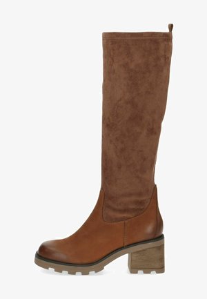 Brown knee-high boots featuring a suede upper, a rounded toe, and a textured block heel, with a smooth leather lower section.