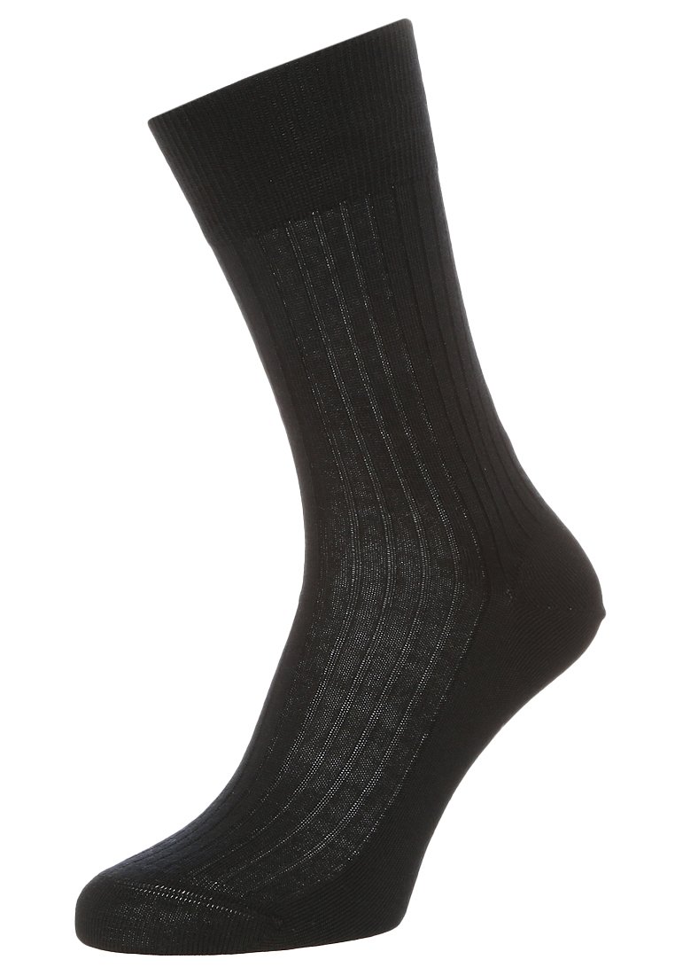 Calza nera a coste realizzata in un materiale morbido ed elasticizzato. Presenta una punta rinforzata e un bordo elastico per una vestibilità sicura.