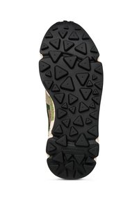 Suela de zapato de goma negra con tapas triangulares, bordes beige y parte superior verde y beige parcialmente visible.