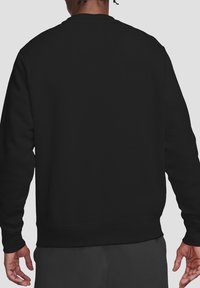 Black sweatshirt featuring a crew neckline, ribbed cuffs and hem, and a smooth texture. No visible logos or patterns, viewed from the back.