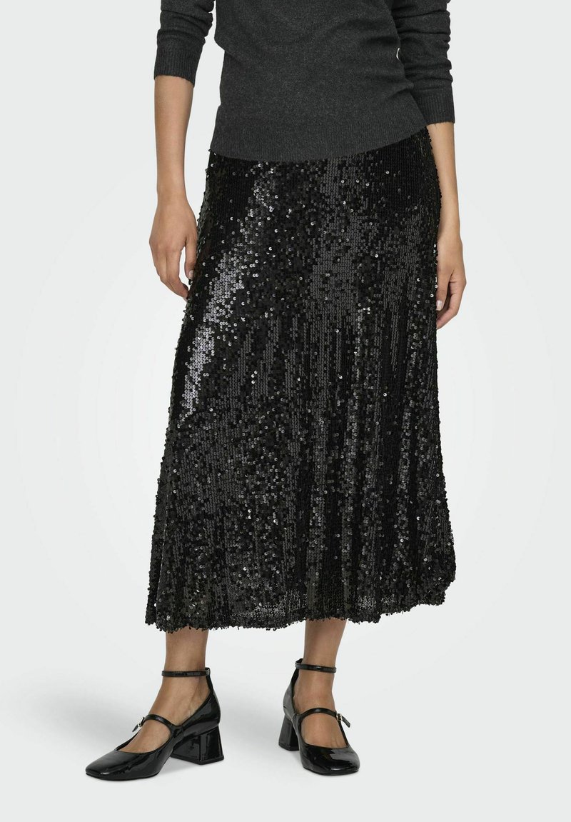 Gonna midi nera con paillettes e design svasato. Presenta una superficie testurizzata di paillettes con una vita liscia. Abbinata a tacchi a blocco in vernice nera.