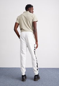 Jordan UNISEX mleczny