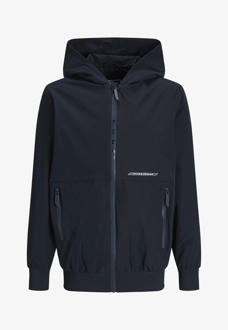 Tamsiai mėlynas su kapuci vilkėjimas striukė su priekiniais užtrauktukais, elastingomis rankovėmis ir dviem šoninėmis kišenėmis, turinčiomis elegantišką apdailą. Medžiaga atrodo lengva ir lygi.