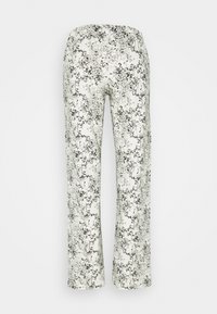 Blumenmusterhose mit elastischem Bund. Der hellfarbige Stoff zeigt filigrane schwarze Muster. Gerade Beinform, weiche Textur.
