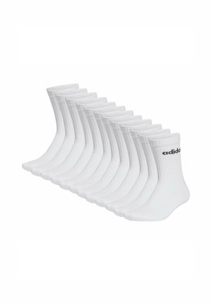 Tolv par vita bomull crew-sockar med ribbad textur, förstärkt tå och svart "adidas"-logotyp på kanten.