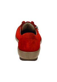 Red suede shoe with a rounded back, rubber sole, and a side zipper. The interior has a textured lining for comfort.