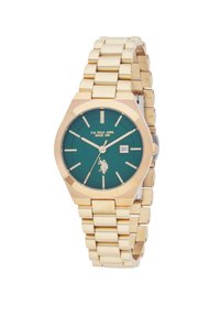 Montre en métal doré avec un cadran vert, boîtier octogonal, index des heures argentés et affichage de la date. Présente un bracelet à maillons.