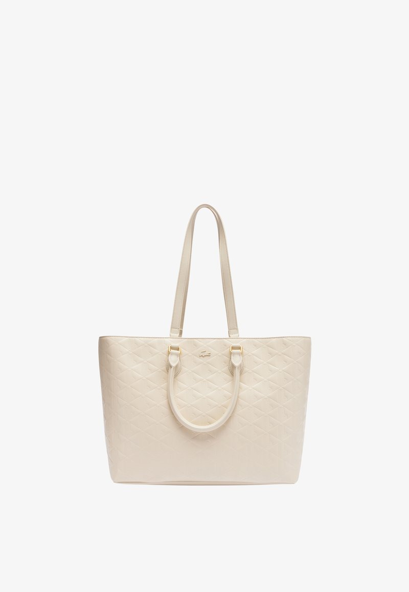 Sac fourre-tout en simili cuir beige matelassé, doté de deux poignées, d'accents dorés et d'un motif en losanges sur l'extérieur.