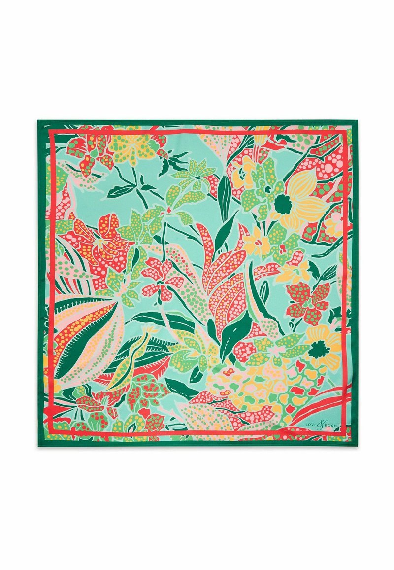 Foulard en soie carré présentant un motif floral vibrant dans des teintes de vert, rouge et jaune, border d'un bord vert uni.