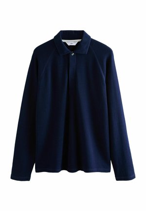 Polo à manches longues marine en tissu texturé, avec un col côtelé, une patte de boutonnage et des manches raglan pour un ajustement décontracté.