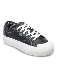 Black leather sneakers with white accents, featuring a textured upper, flat white laces, and a patterned interior lining. Thick rubber sole.