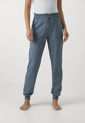 Blauwe joggerbroeken bedrukt met een ingewikkeld geometrisch patroon. Voorzien van een elastische tailleband en boorden, met een comfortabele pasvorm.