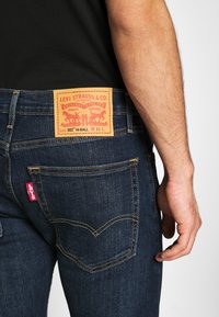 Levi's® 502™ TAPER HI-BALL - Calças de ganga de perna direita - med indigo