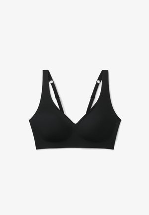 Zwarte naadloze draadloze beha met verstelbare bandjes en gevormde cups, ontworpen voor comfortabel dagelijks gebruik en een soepele pasvorm.