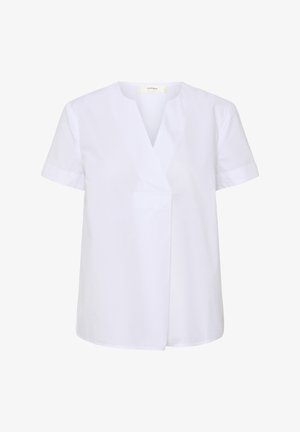 Vit kortärmad blus med V-ringning och avslappnad passform. Tillverkad av mjukt tyg med en sidofickan. Enkel och ren design.