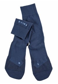 Calcetines de punto azul marino con puños acanalados, áreas de puntera y talón reforzadas, etiquetados con '7' y el nombre de la marca. Textura suave y diseño versátil.