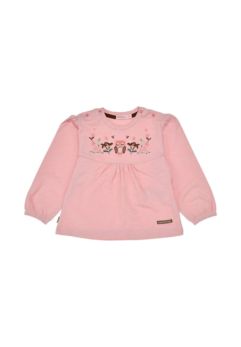 Camicetta rosa a maniche lunghe in tessuto morbido, con ricamo floreale e dettagli con bottoni sulle spalle. Stile plissettato in vita.
