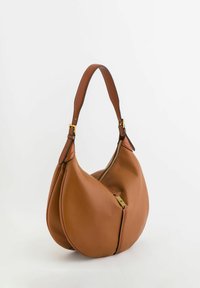 Hobo bag made of textured brown leather, featuring a curved shape, a gold zipper, and a shoulder strap with a gold hardware accent.