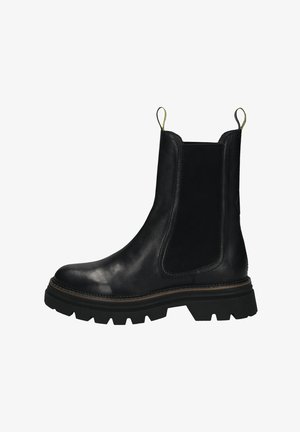 Stivale Chelsea in pelle nera con lati textured, suola in gomma prominente e linguette per la facilitazione dell'indossamento. Presenta una finitura liscia e cuciture marroni a contrasto.