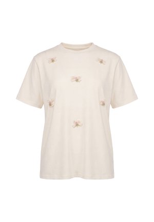 Cremefarvet T-shirt med korte ærmer dekoreret med små kniplingesløjfer og lyserøde rosepynt fordelt på forsiden.