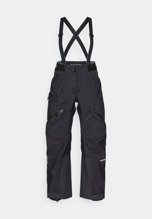 Black technical pants with suspenders, featuring multiple zippered pockets, reinforced knees, and a durable, waterproof fabric.