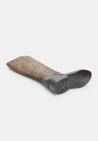 Brown leather knee-high boots, featuring a smooth finish, rubber sole with detailed tread, and a wide top opening.