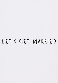 White t-shirt featuring the text "LET'S GET MARRIED" in bold, black, modern font, centered on the front, with a smooth texture.