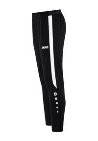 Pantalon de sport noir avec une bande latérale blanche et le logo JAKO. Caractéristiques : coupe cintrée, taille élastique et six boutons décoratifs d'un côté.