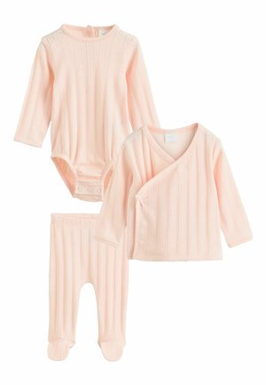 Soft pink ribbed knit baby set with long-sleeve bodysuit, wrap-style top, and footed pants in matching textured fabric.