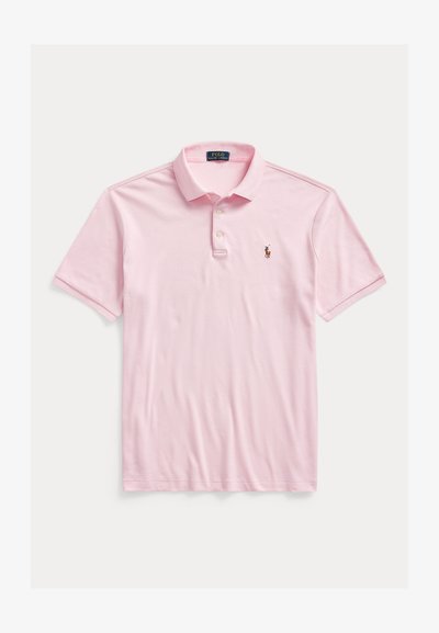 Světle růžové polokošile z měkké látky, s klasickým límečkem, zapínáním na tři knoflíky a vyšitým logem na levé straně hrudi.