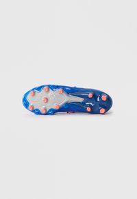 Blue and pink soccer cleat sole with a textured gray surface; features multiple studs in bright orange and a streamlined design.