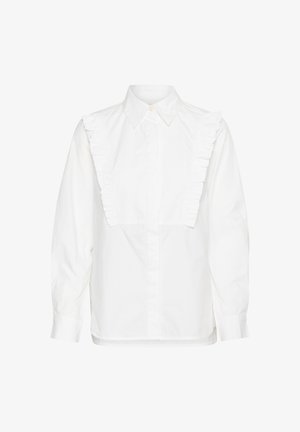Cămașă din bumbac alb cu accente volărate pe umeri, mâneci lungi și închidere cu nasturi pe față. Croială lejeră cu guler clasic.