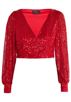 Red sequin crop top with long puff sleeves, deep V-neckline, and textured fabric. Features gathered detail at the waist and cuffed sleeves.