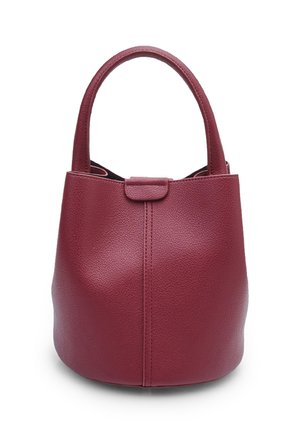 Round, burgundy leather bag with textured surface, short handles, and a minimalistic design. Closure tab at the front.