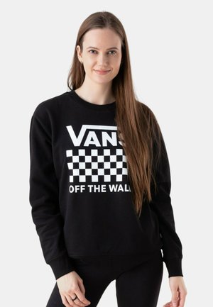Sudadera negra de algodón con cuello redondo. Presenta un patrón de damero blanco y el logo "VANS OFF THE WALL" de manera destacada.