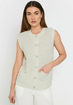 Lyscremet ærmeløs strikket cardigan med et tekstureret mønster, der har knaplukning og to forlommer, lavet af blødt materiale.