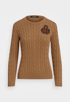 Brown cable-knit sweater with ribbed hem. Features a round neckline and decorative embroidered logo on the chest, with gold shoulder buttons.