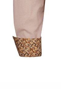Polsino di camicia a quadri marroni con motivo floreale in tonalità di arancione e crema. Tessuto morbido con design a contrasto all'orlo arrotolato.