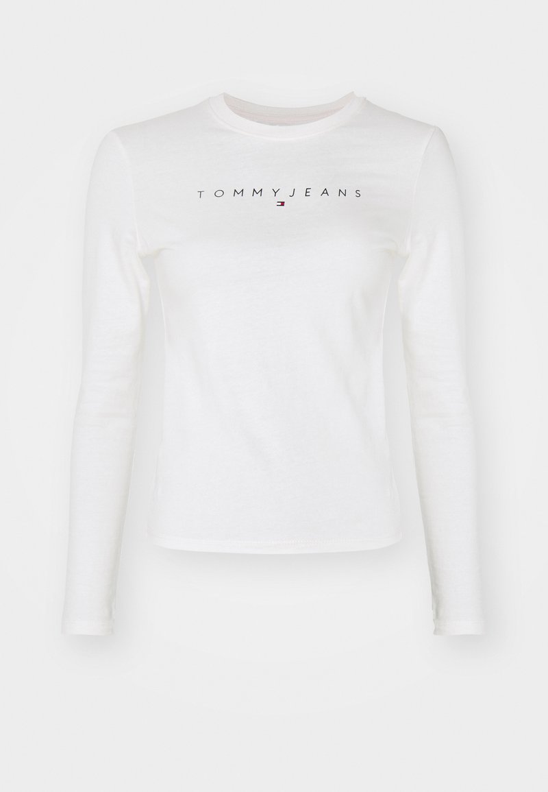 Biała długa koszula z bawełny z okrągłym dekoltem. Z przodu znajduje się czarne i czerwone logo "TOMMYJEANS". Prosty design.