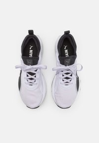 Light gray athletic shoes with black accents, featuring a textured upper, lace-up front, and PUMA logo on the tongue and side.