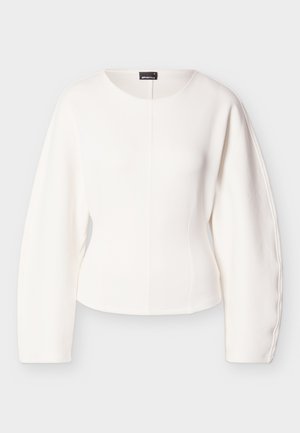 Balts īss tops ar garām, strukturētām piedurknēm. Gluda tekstūra, apaļa kakla līnija un vidusa šuve. Minimālistisks dizains, bez redzamām aizdares vietām.